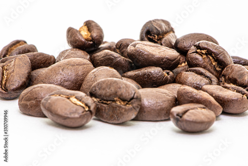 Close up of coffee beans on a white background