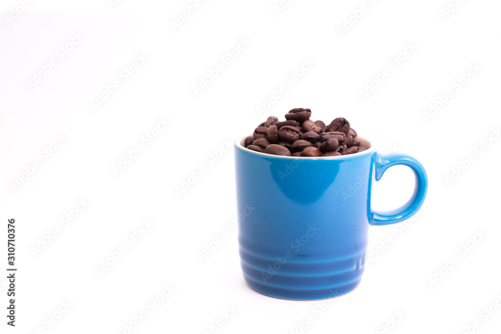 Coffee mug filled up with coffee beans Coffee mug filled up with coffee beans