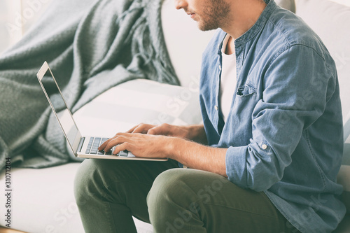 Handsome man with laptop on...