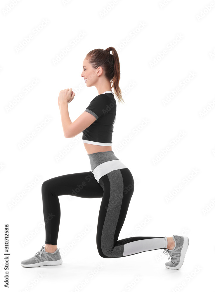 Sporty young woman training against white background Sporty young woman training against white background