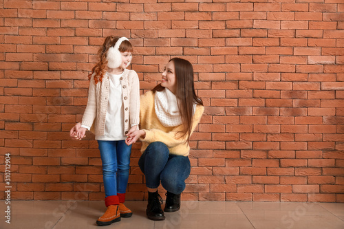 Cute little girl with mothe...