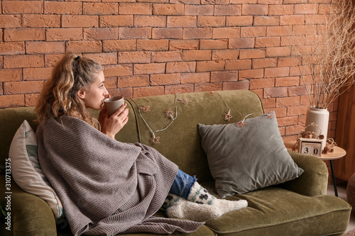 Young woman with knitted pl...