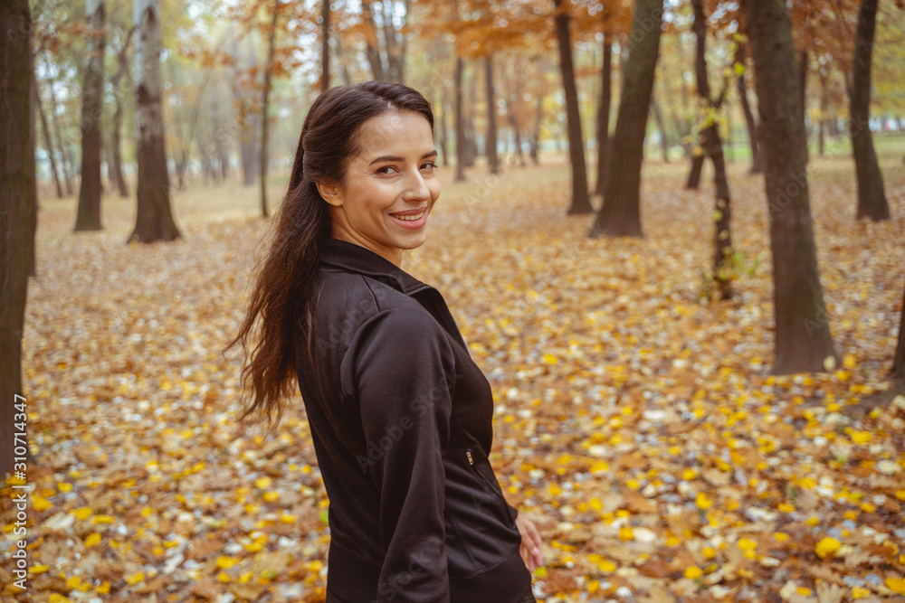 Cheerful young woman having active morning walk Cheerful young woman having active morning walk