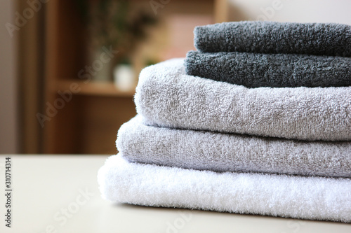 a stack of fresh towels on the table. photo