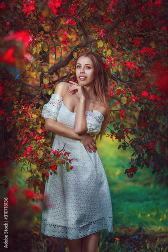 beautiful girl in  cherry garden in spring