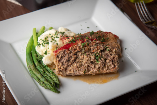 meat loaf with mashed potato and asparagus