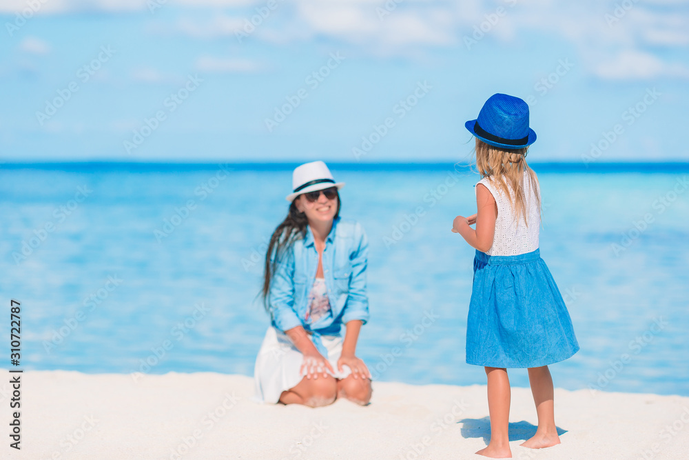 Beautiful mother and daughter on Caribbean beach Beautiful mother and daughter on Caribbean beach
