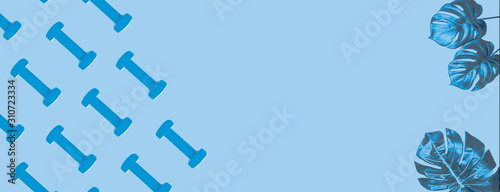 Blue dumbbell pattern on classic blue background with copy space.