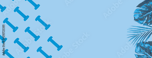 Blue dumbbell pattern on classic blue background with copy space.