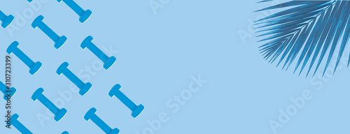 Blue dumbbell pattern on classic blue background with copy space.
