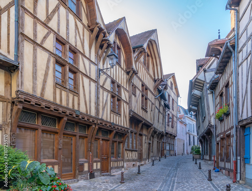 Troyes, France - 09 08 2019: Typical street with half-timbered facades photo