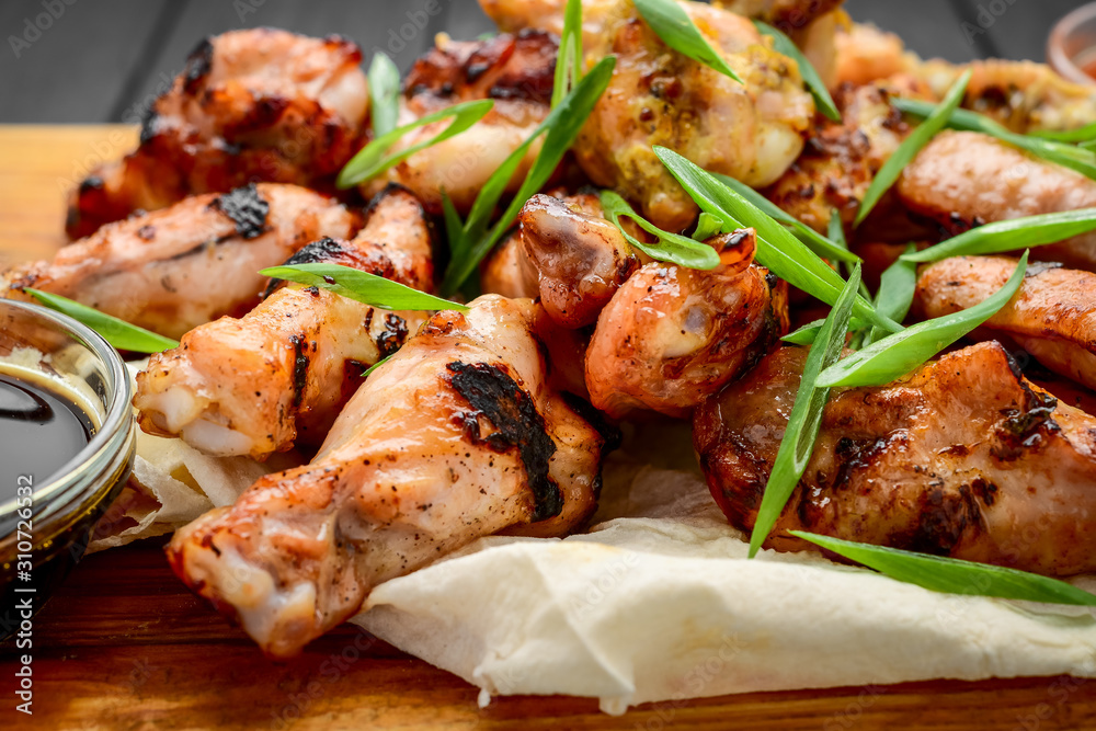 chicken wings and legs on a wooden table chicken wings and legs on a wooden table