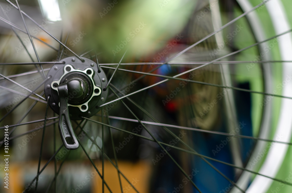 Bicycle repair On the hook hang new wheels. The rim, spokes