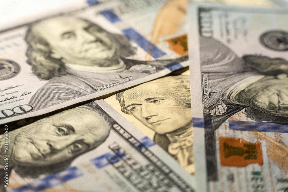 Close up of different dollar bills as background. Amarican dollars pattern. Top view of business concept. Close up of different dollar bills as background. Amarican dollars pattern. Top view of business concept.