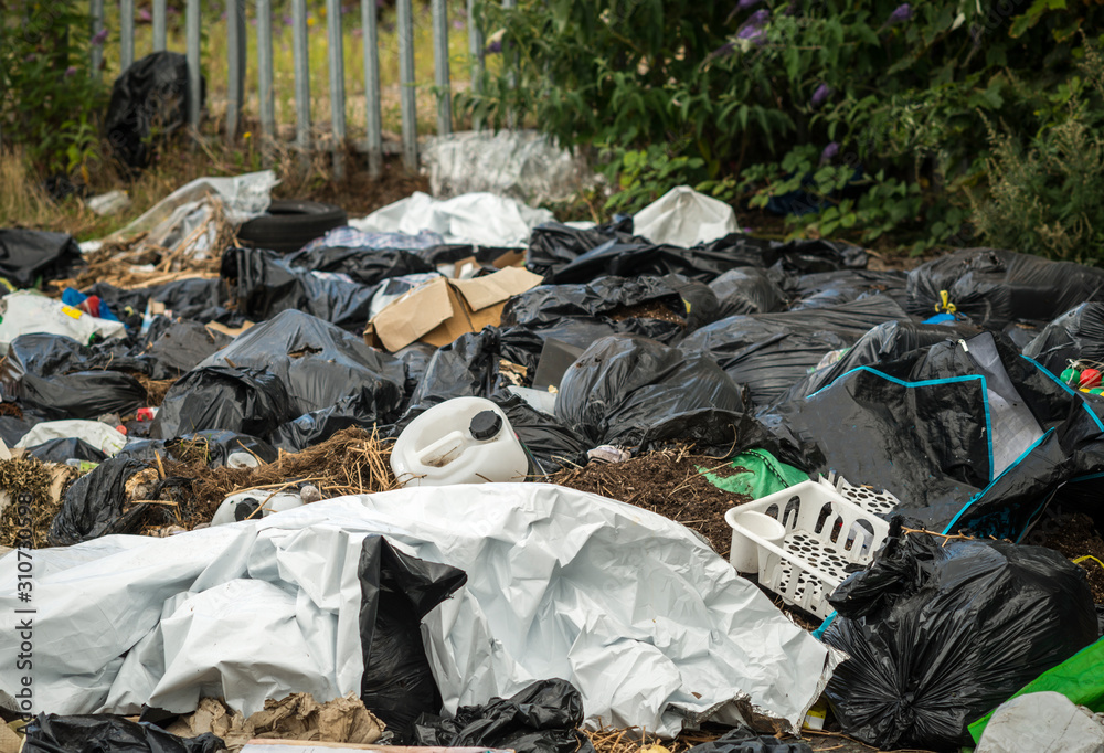 Fly tipping in urban street, West Midlands, UK
