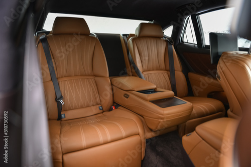 Rear leather seats in luxury car. © vpilkauskas