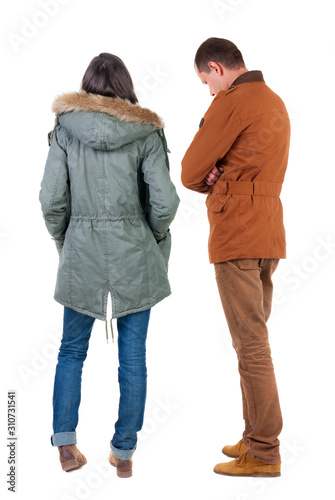 Back view of couple in winter jacket.