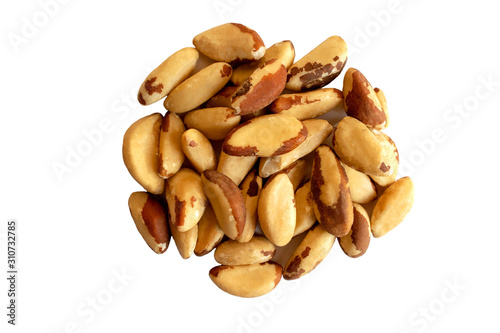Many delicious Brazilian nuts isolated on white background. Healthy snack and food. Top view. Heap of brazil nuts.