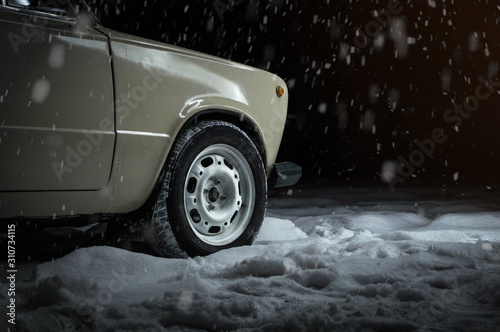 car wheels and tires in the snow in winter in the cold