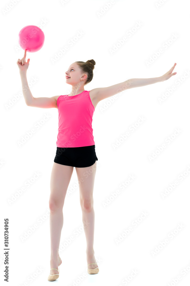 Girl gymnast performs exercises with the ball. Girl gymnast performs exercises with the ball.