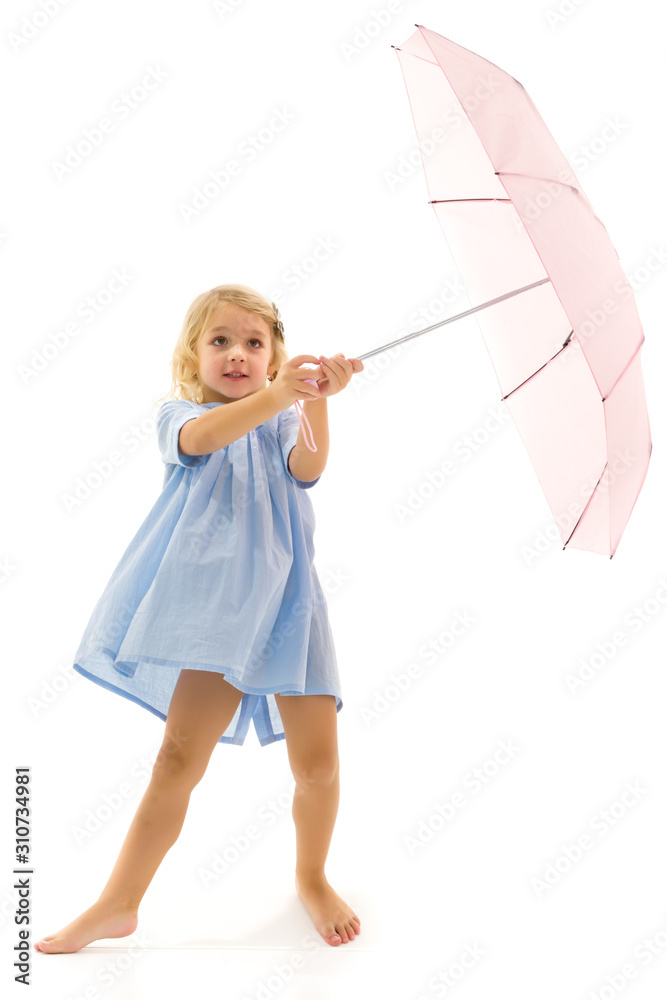Little girl under an umbrella.Concept style and fashion. Isolate Little girl under an umbrella.Concept style and fashion. Isolate
