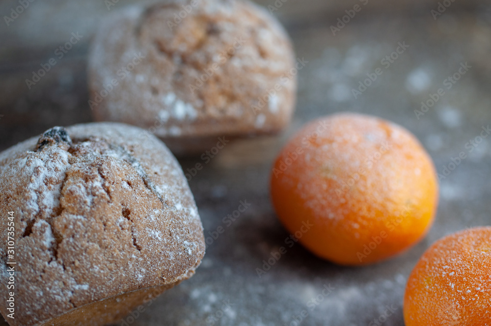 delicious fresh muffins with flour on a wooden table delicious fresh muffins with flour on a wooden table