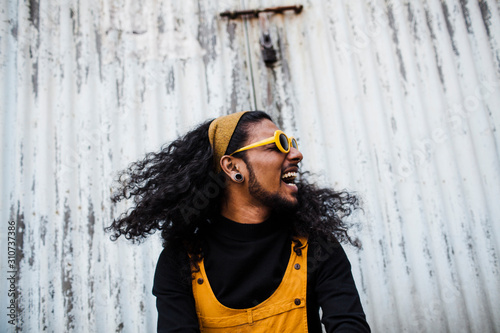 Portrait of a smiling young south asian man.