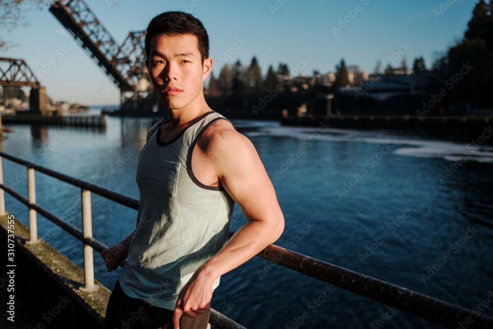 Asian American athlete standing outdoors Asian American athlete standing outdoors