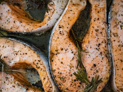Baked fish with spices and rosemary photo