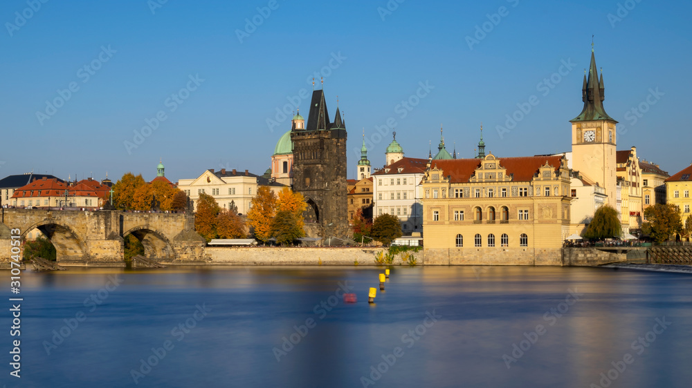 Warm Autumn day time view on Prague over rivver