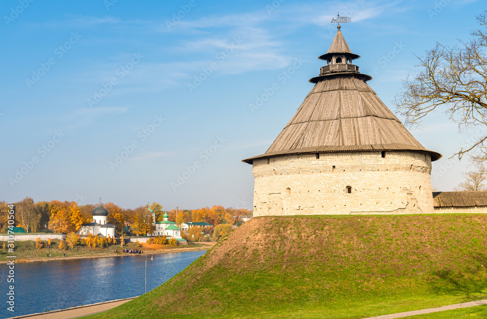 Pokrovskaya fortress Tower of Pskov on the shore of Velikaya river, Russia