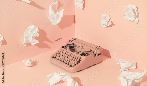 Pink Office Typewriter With White Paper photo