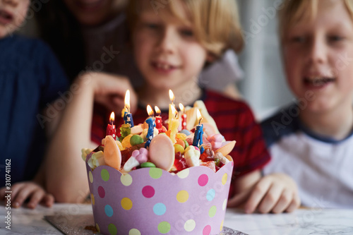 Children around a birthday cake