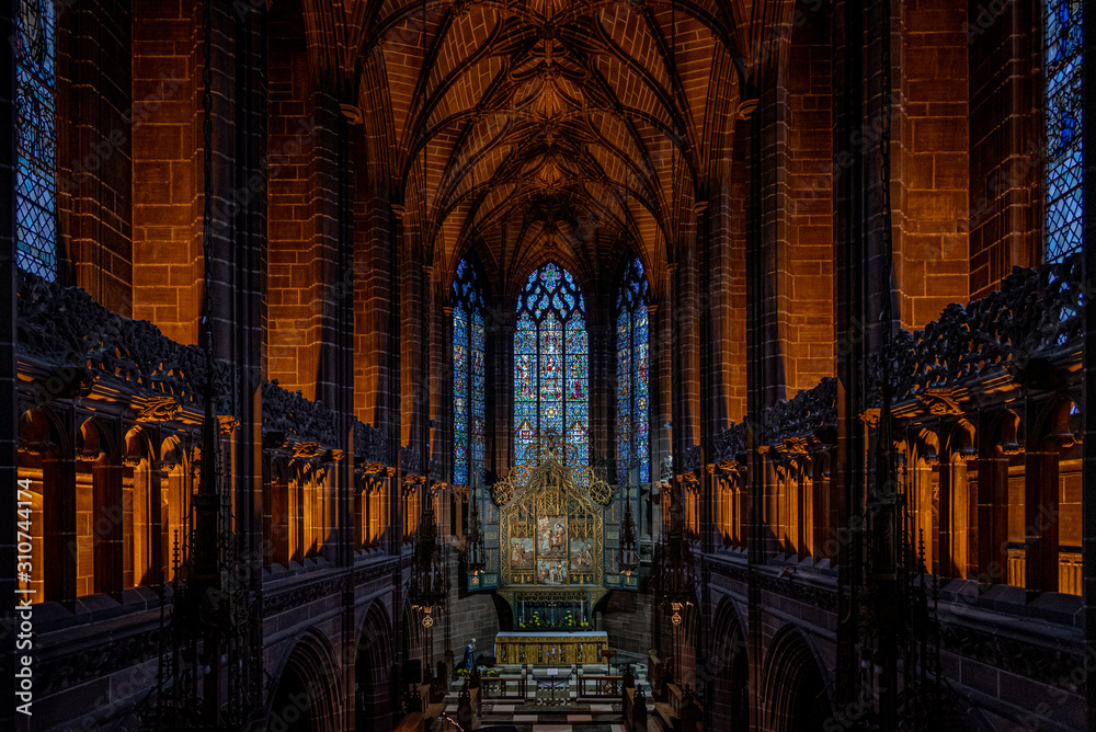 LIVERPOOL, ENGLAND, DECEMBER 27, 2018: The Lady Chapel in Liverpool Anglican Cathedral. Perspective view of a magnificent part inside the church, where light meets darkness all along place.