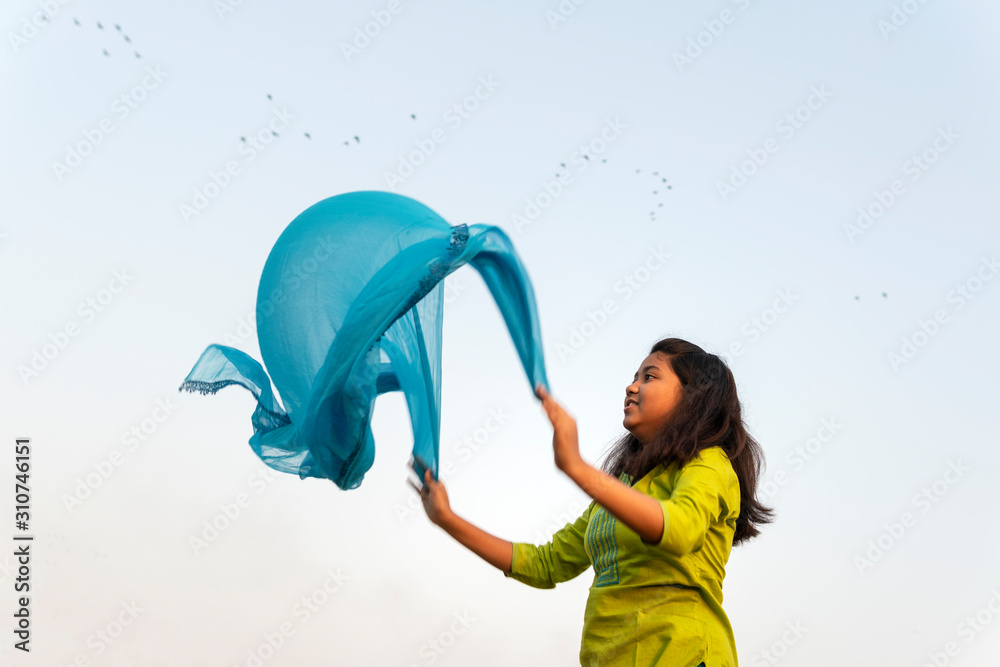 Teenage Girl Making Fun With Churni At Outdoors Teenage Girl Making Fun With Churni At Outdoors