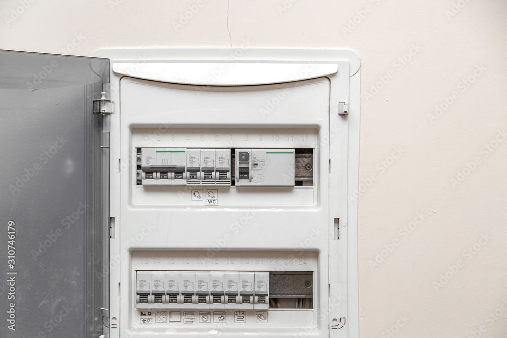Electricity distribution box. Fusebox. Isolated on apartment wall Electricity distribution box. Fusebox. Isolated on apartment wall