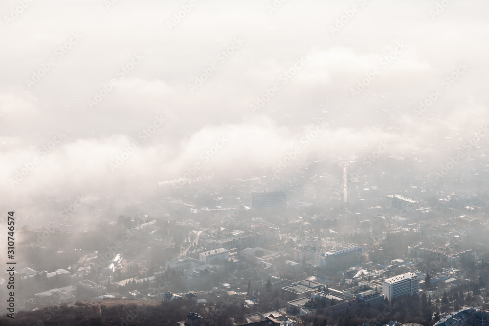 aerial view of the city through the clouds