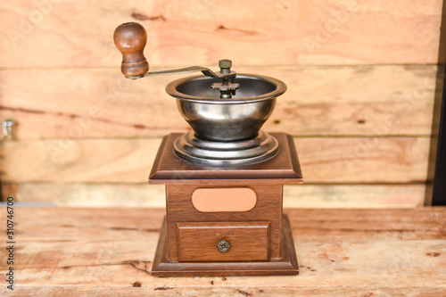 Coffee grinder with wood background