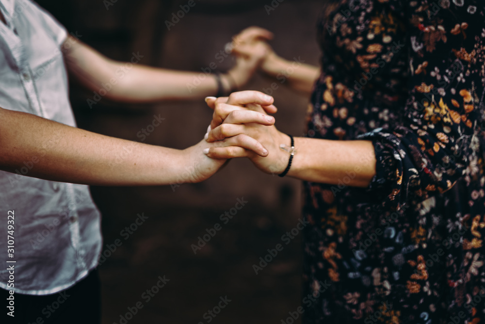 Detail photo of hands holding Detail photo of hands holding