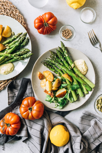 Roasted asparagus and potatoes with salad