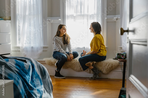 Mother and Daughter having Private Chat at Home photo