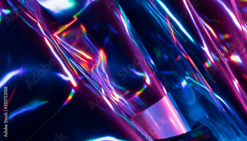 Reflection of light on holographic foils with neon lighting photo