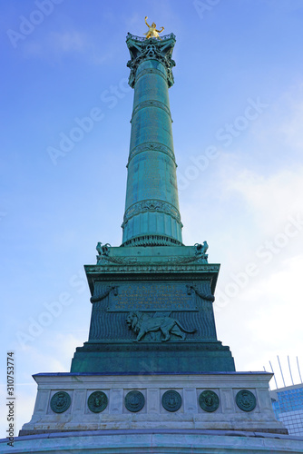View of the green blue bronze July Column statue on the Place de la Bastille in Paris commemorating the French revolution