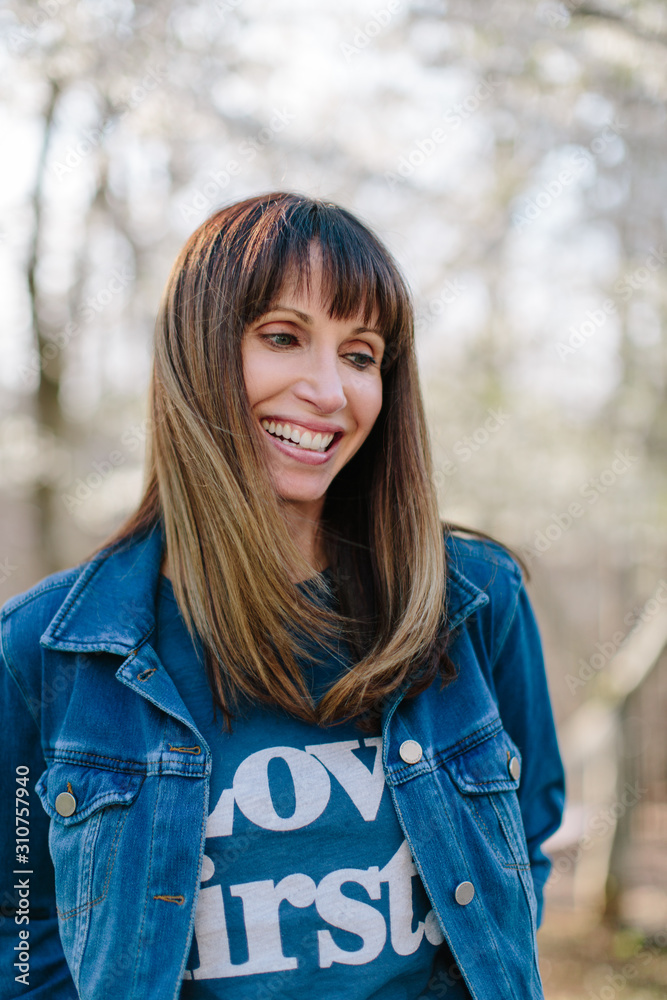 Portrait of a smiling beautiful woman in a denim jacket Portrait of a smiling beautiful woman in a denim jacket