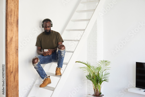 Wallpaper Mural Black afro bearded man listening music. Torontodigital.ca