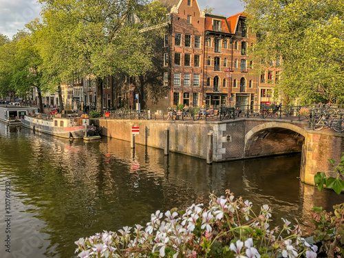 Bridge and Houseboats Along a Canal in Amsterdam