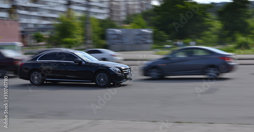 black car in the city filmed in motion