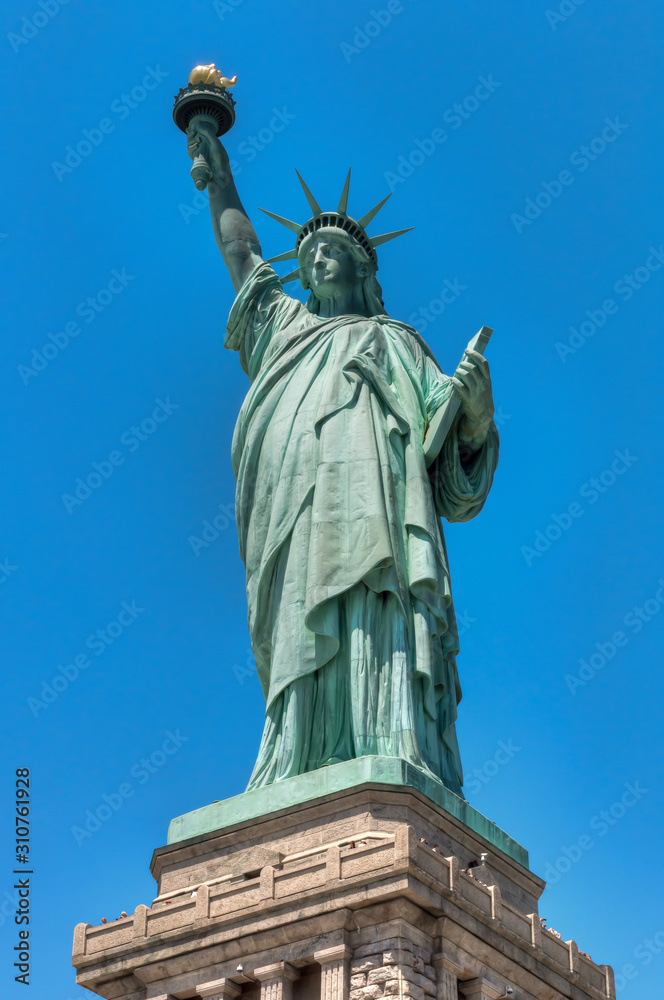 Statue of Liberty, New York against a clear blue sky.