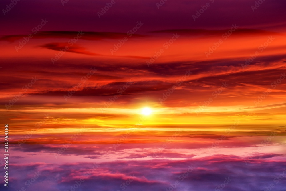 Beautiful sunset .  Beautiful heavenly landscape with the sun in the clouds . View of clouds from high altitude . Paradise heaven .light about the sky     . Sky background . 