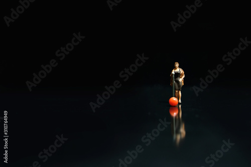 Fotografija Miniature photography - elegant women singer singing on shiny black stage